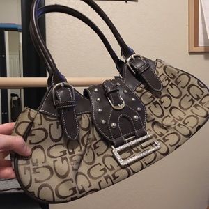 Sold Tan gold purse with G letter patterns